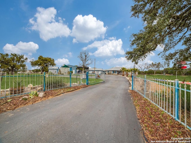 view of street featuring a gate