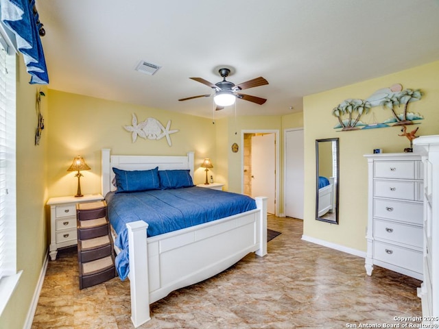 bedroom with ceiling fan, visible vents, and baseboards