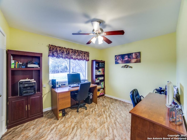 office area featuring baseboards and a ceiling fan