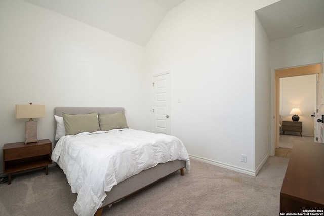 bedroom with light carpet, high vaulted ceiling, and baseboards