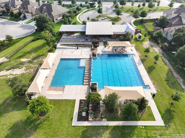 pool featuring a residential view and a patio area