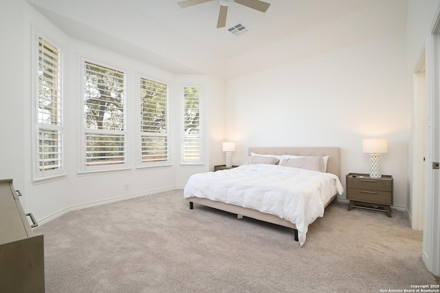 carpeted bedroom featuring ceiling fan, visible vents, and baseboards