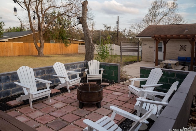 view of patio / terrace featuring an outdoor fire pit, a pergola, and a fenced backyard