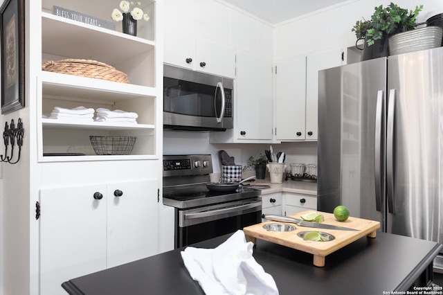 kitchen with white cabinets, light countertops, appliances with stainless steel finishes, open shelves, and crown molding