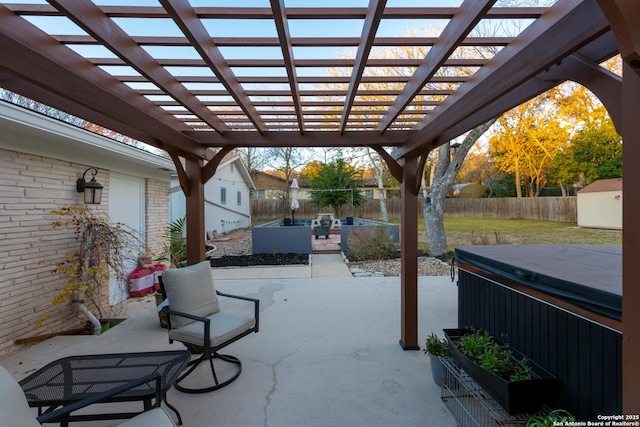 view of patio featuring a hot tub, a pergola, a fenced backyard, and an outdoor structure