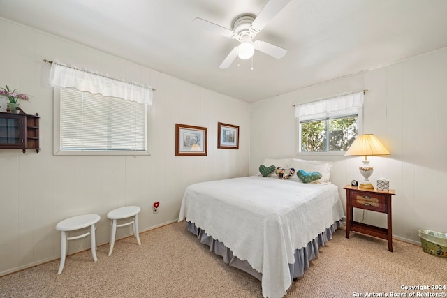 bedroom with light carpet and ceiling fan