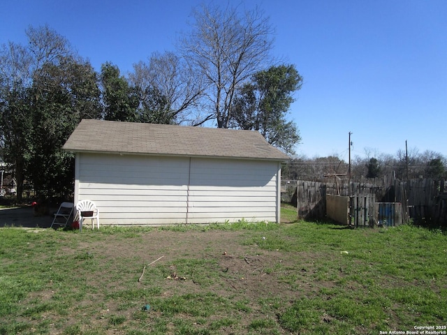 exterior space with a storage shed and fence