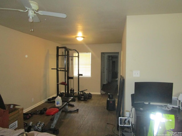 exercise room with ceiling fan, wood finished floors, and baseboards