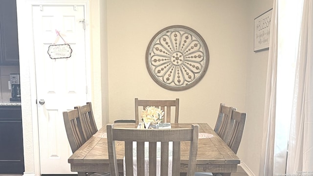 dining space featuring baseboards