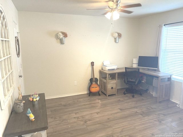 home office with ceiling fan, baseboards, and wood finished floors