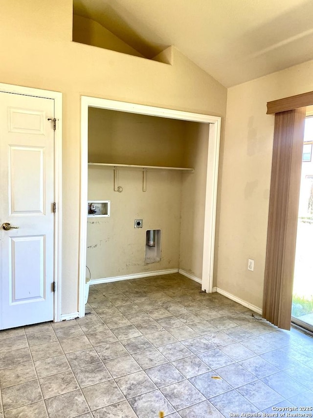 laundry area with laundry area, plenty of natural light, hookup for a washing machine, and hookup for an electric dryer