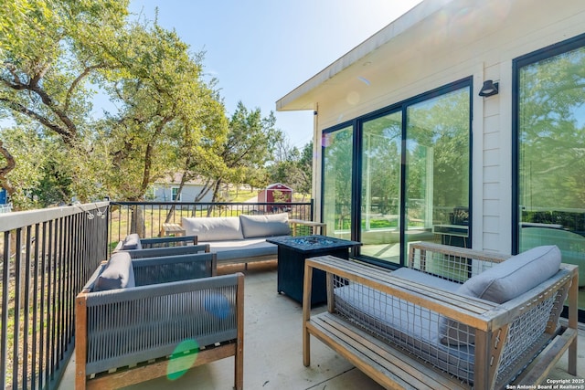 exterior space with an outdoor living space with a fire pit