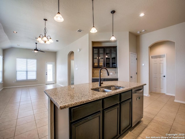 kitchen featuring visible vents, a sink, stainless steel dishwasher, and light tile patterned floors