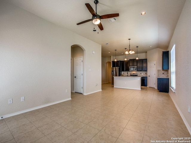 unfurnished living room with visible vents, arched walkways, baseboards, vaulted ceiling, and ceiling fan with notable chandelier