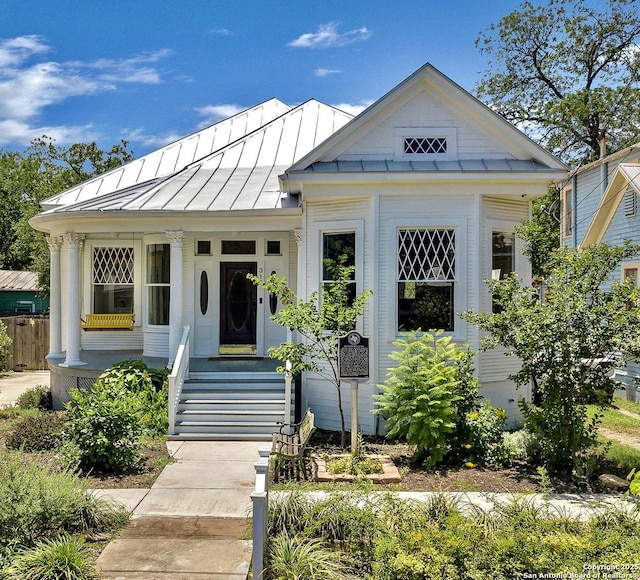317 Wickes, San Antonio, TX 78210 - view of front of house featuring a standing seam roof, covered porch, and a metal roof