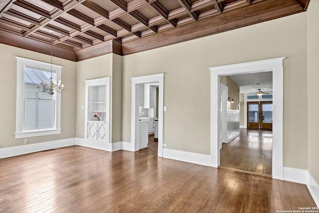 317 Wickes, San Antonio, TX 78210 - empty room featuring a chandelier, coffered ceiling, crown molding, dark wood-style flooring, and beamed ceiling