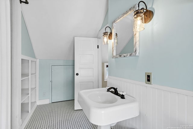 317 Wickes, San Antonio, TX 78210 - bathroom featuring wainscoting, vaulted ceiling, and tile patterned floors