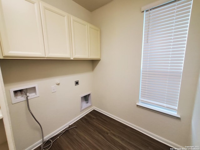 laundry room with hookup for a gas dryer, washer hookup, baseboards, cabinet space, and electric dryer hookup