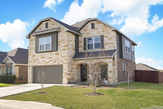 traditional-style house featuring concrete driveway, an attached garage, fence, stone siding, and a front lawn