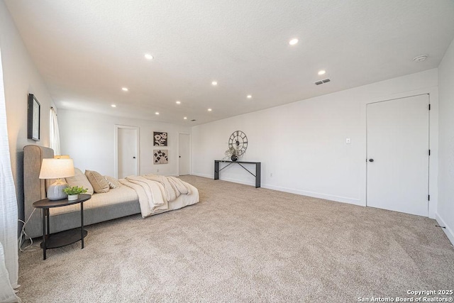 bedroom with baseboards, carpet floors, visible vents, and recessed lighting