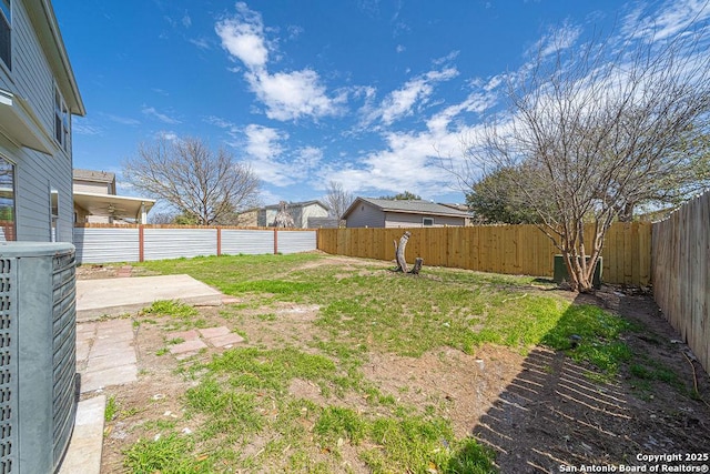 view of yard featuring a patio and a fenced backyard