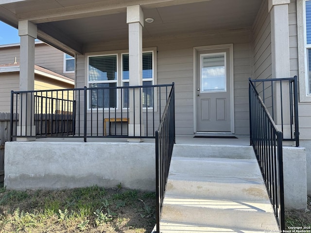 property entrance featuring covered porch