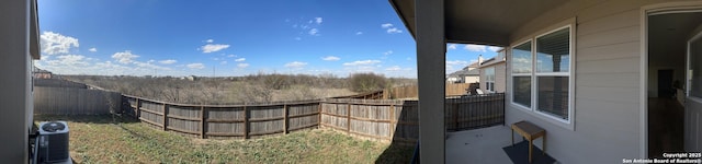 view of yard with cooling unit and a fenced backyard