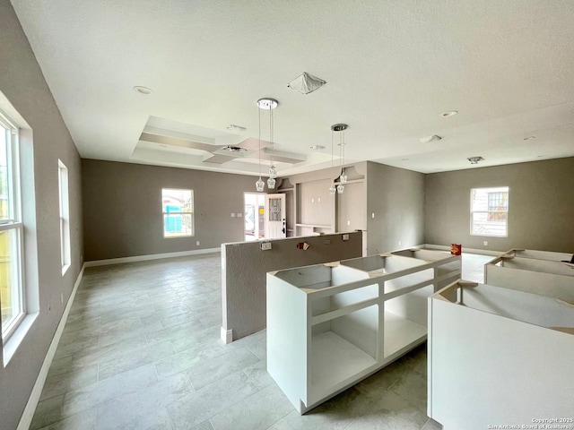 kitchen with open floor plan, a wealth of natural light, and a center island