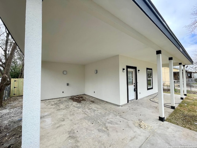 view of patio / terrace featuring fence