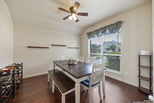 dining room with ceiling fan, baseboards, vaulted ceiling, and wood finished floors