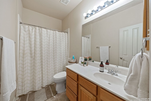 bathroom with visible vents, toilet, curtained shower, tile patterned flooring, and vanity