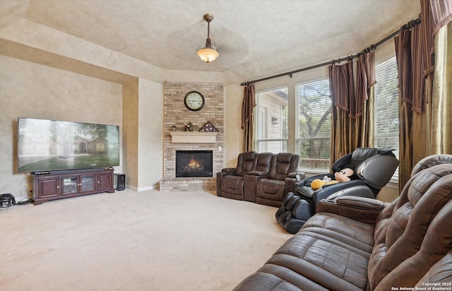 carpeted living room with a brick fireplace and baseboards