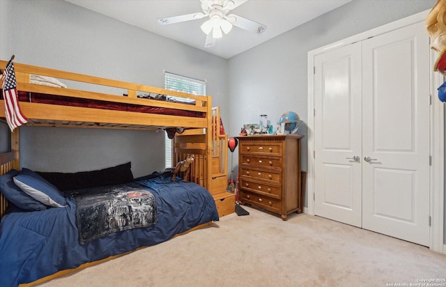 bedroom featuring light carpet and ceiling fan