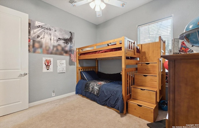 bedroom with carpet floors, ceiling fan, and baseboards