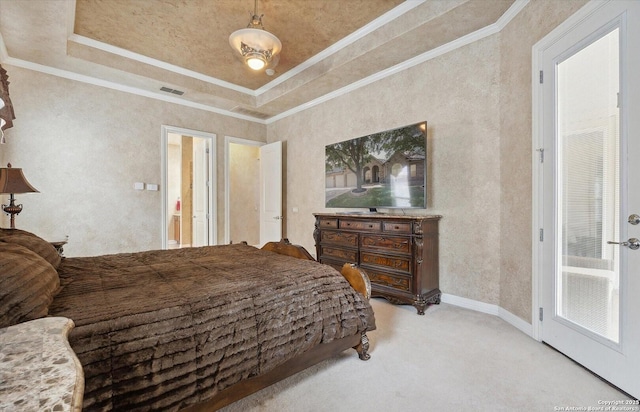 carpeted bedroom featuring a tray ceiling, visible vents, and crown molding