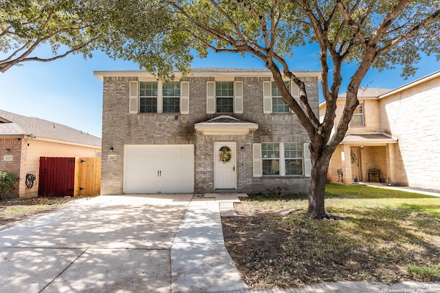 view of front of property with a garage, concrete driveway, brick siding, and fence