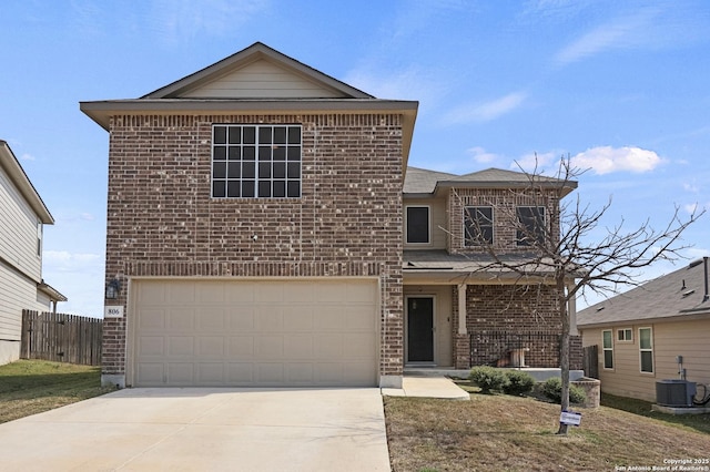 traditional-style house with an attached garage, cooling unit, brick siding, fence, and concrete driveway