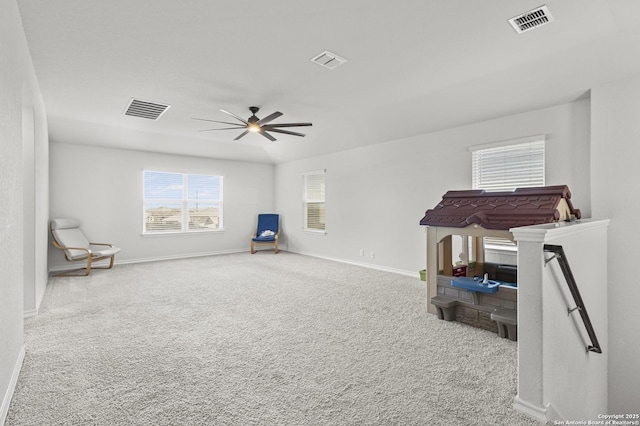 living area featuring carpet, visible vents, and baseboards