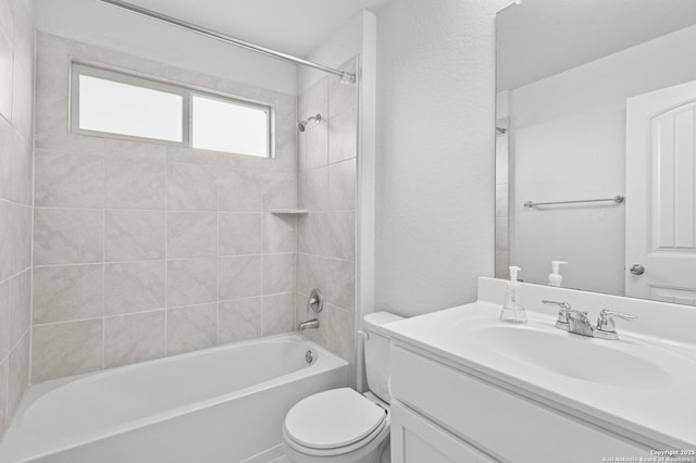 full bath featuring shower / bath combination, a textured wall, vanity, and toilet