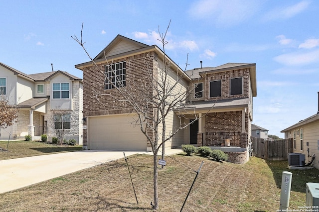 traditional-style house featuring driveway, central AC unit, an attached garage, fence, and brick siding