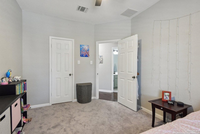 carpeted bedroom featuring visible vents, ceiling fan, and baseboards