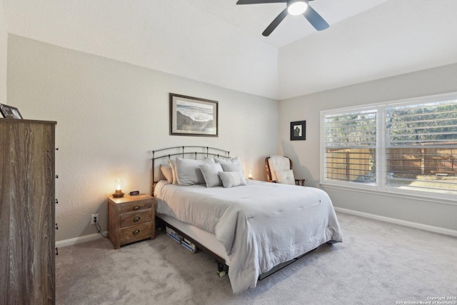 carpeted bedroom featuring lofted ceiling, ceiling fan, and baseboards