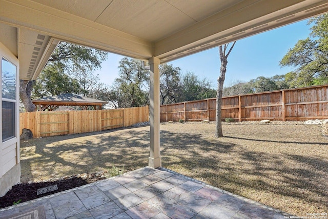 view of yard with a fenced backyard and a patio