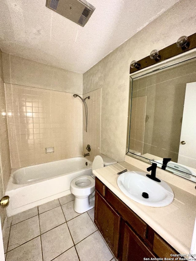 full bathroom with visible vents, toilet, vanity, shower / tub combination, and tile patterned floors