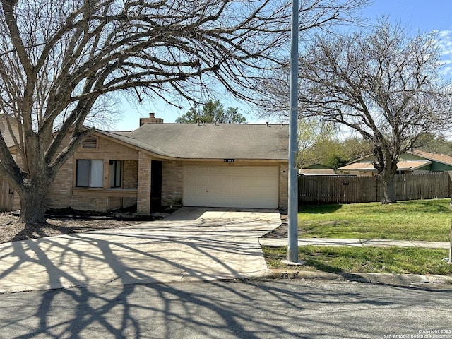 view of front of house featuring brick siding, a chimney, an attached garage, fence, and driveway