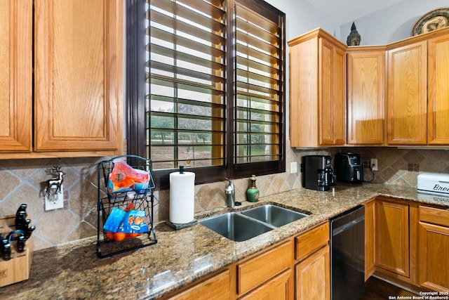 kitchen with decorative backsplash, dishwashing machine, light stone counters, and a sink