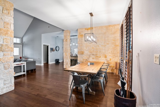 dining space featuring visible vents, baseboards, and dark wood-style floors