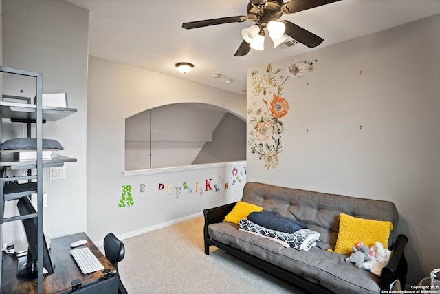 carpeted living area featuring visible vents, baseboards, and ceiling fan