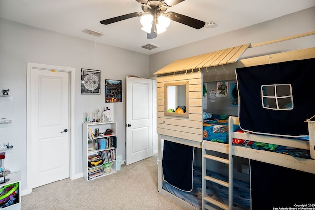 bedroom featuring visible vents, a ceiling fan, and carpet flooring