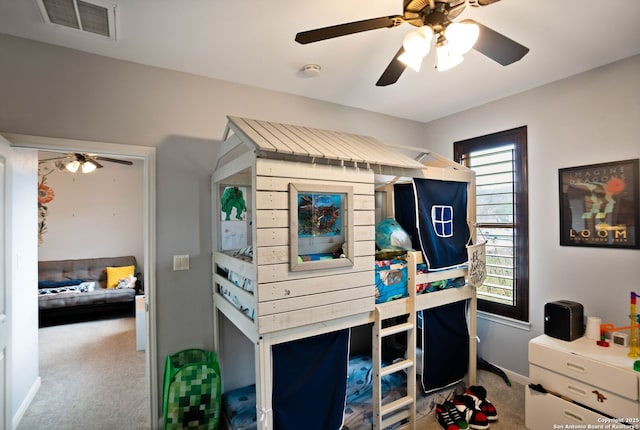bedroom with baseboards, carpet flooring, a ceiling fan, and visible vents